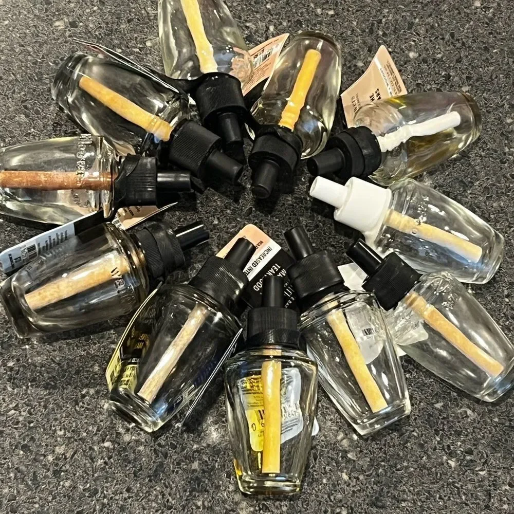 12 Empty wallflower refill bottles